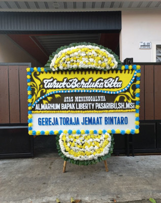 Papan Bunga Duka di Mantikulore